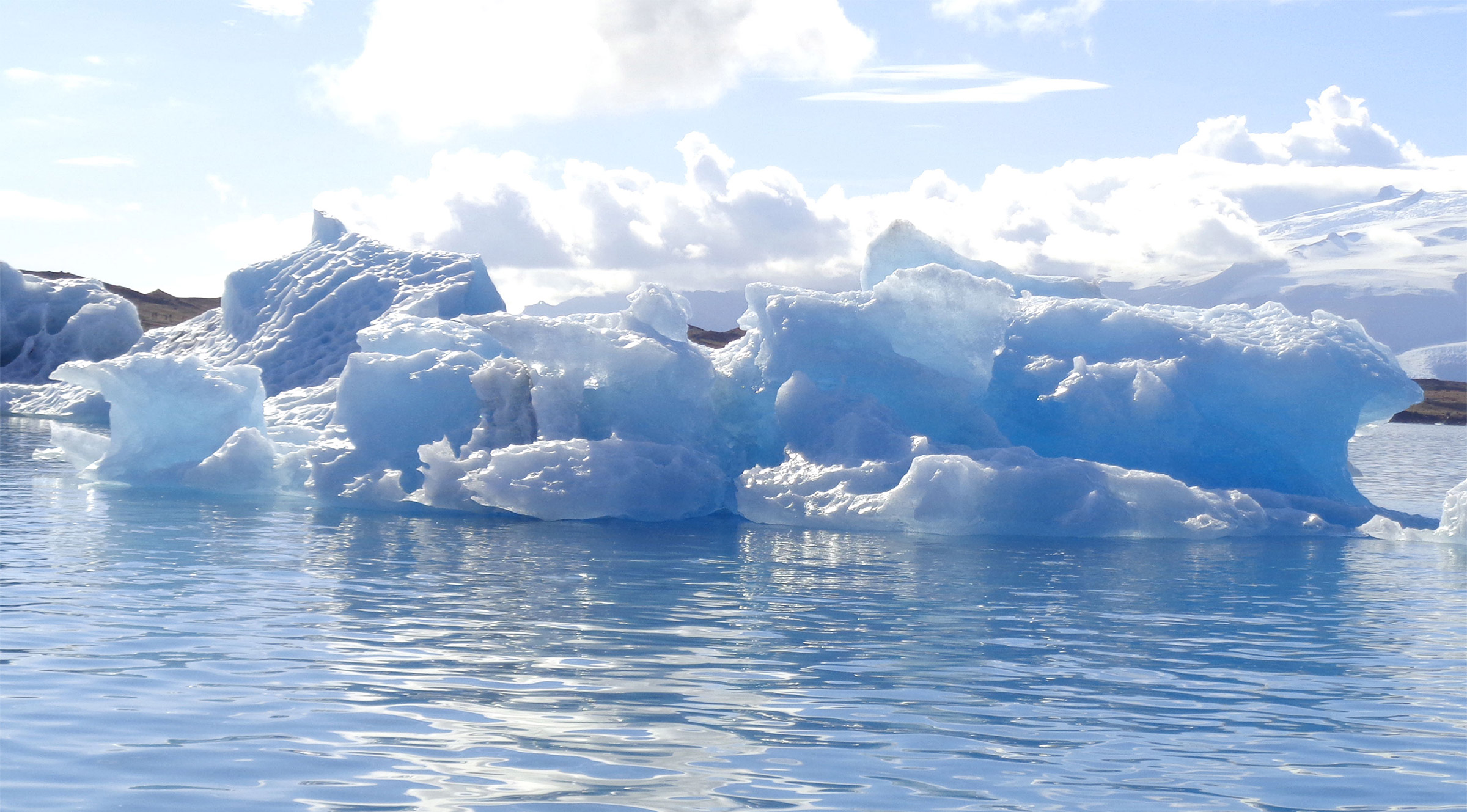 Iceberg floating in lagoon.